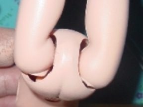 Close-up of a jointed doll limb connection.