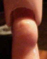 Close-up of a finger tip with soft lighting.